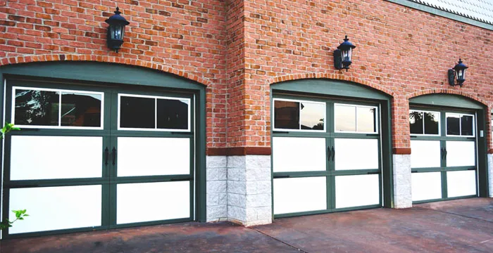 Modern full-view aluminum and glass garage doors on a commercial building